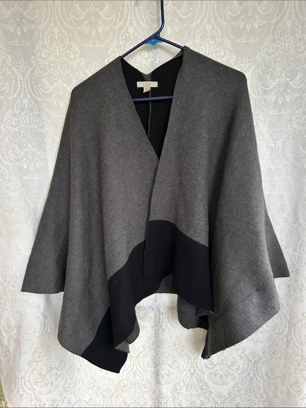 LOFT Gray & Black Two-Tone Open-Front. Is a jacket cut in arms